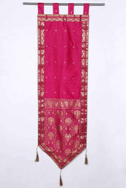 Pink sari wall hanging displayed on a wall