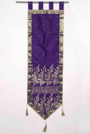Purple sari wall hanging displayed on a wall