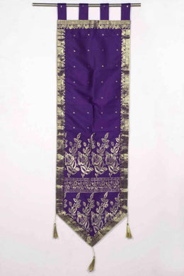 Purple sari wall hanging displayed on a wall