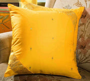 Yellow sari cushion covers arranged on a sofa
