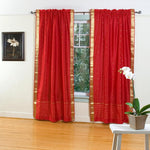 Fire brick sari rod pocket curtains hung at a window