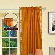 Mustard sari rod pocket curtains hung at a window